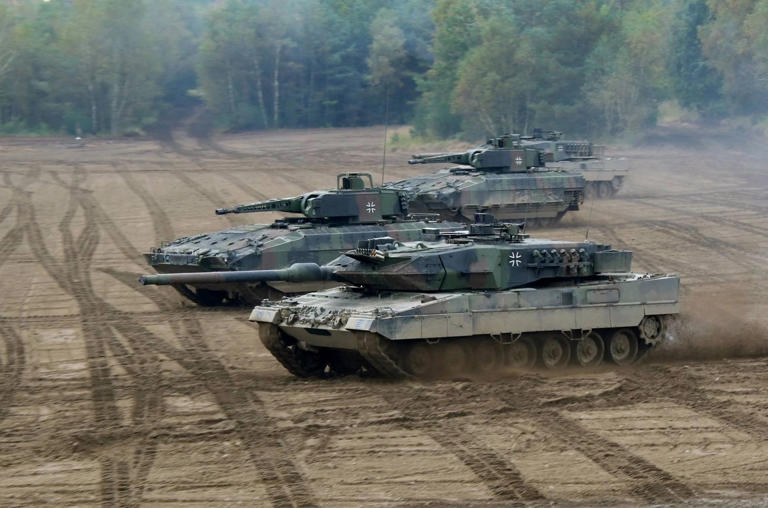 German tank Leopard 2 and infantry fighting vehicles Puma - illustrative photo