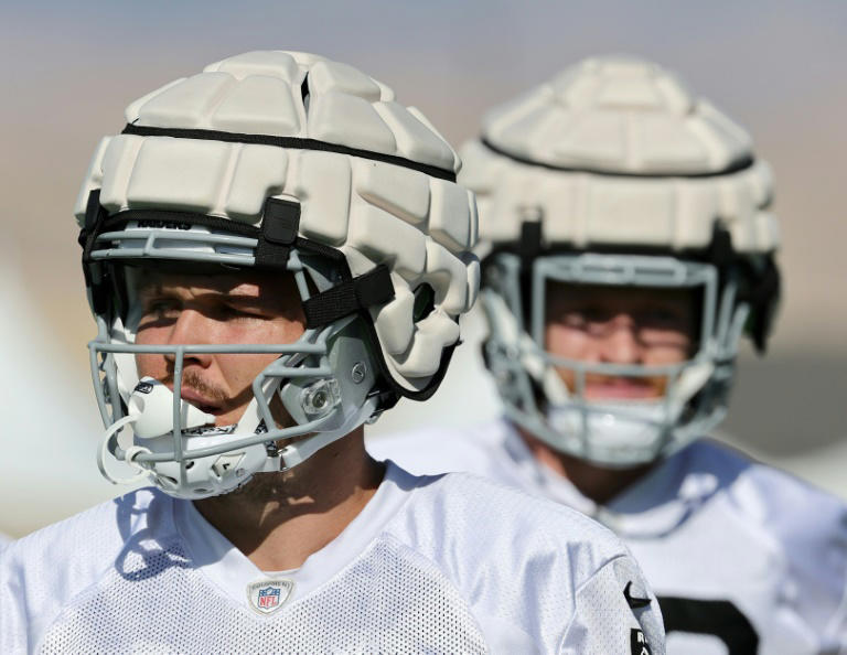 NFL tight ends Jesper Horsted and Nick Bowers of the Las Vegas Raiders practiced last season while wearing Guardian Caps, which will be allowed for players in regular-season NFL games starting next season