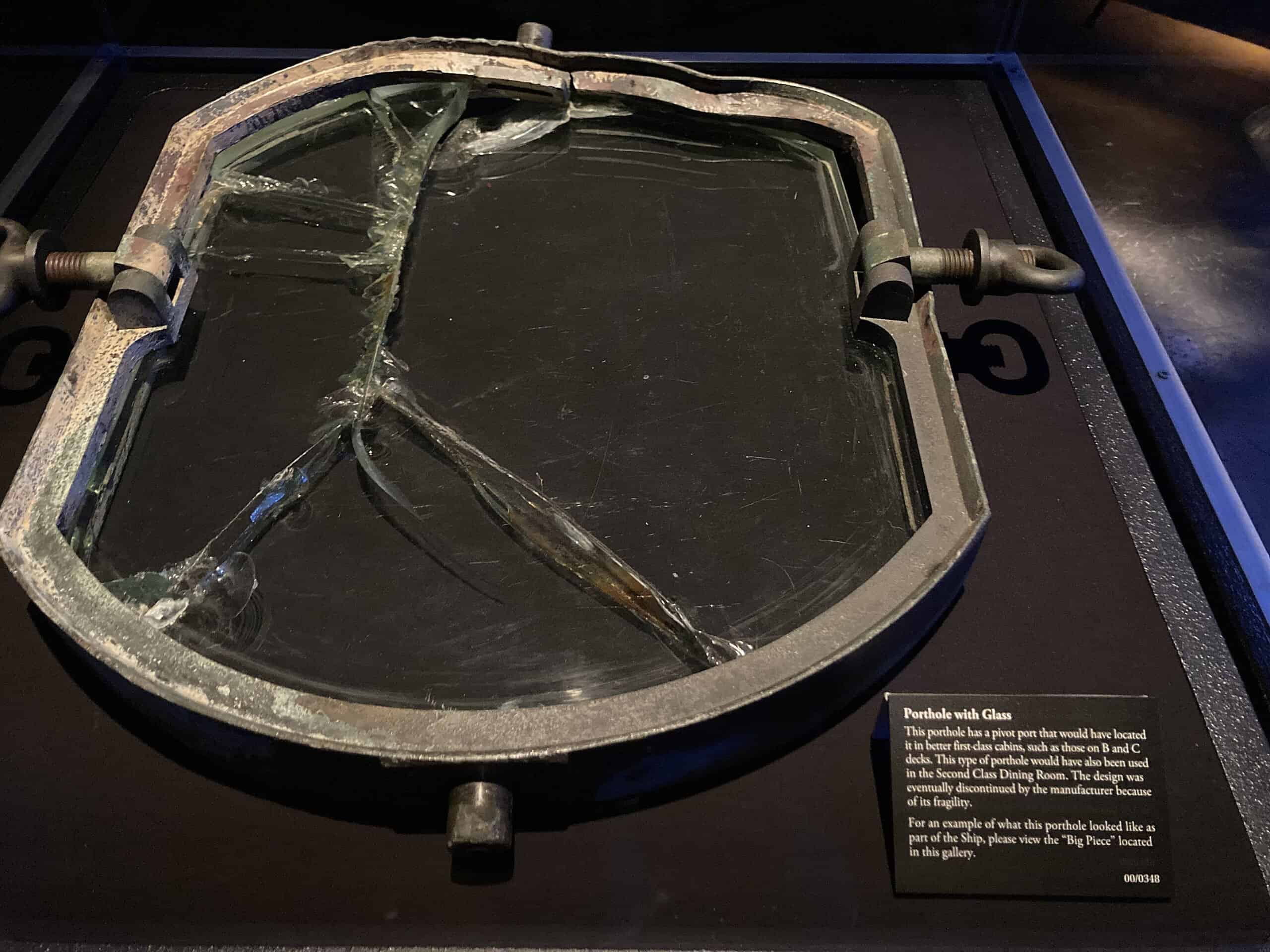 <p>Among the incredible finds that have been recovered from the Titanic’s wreckage is this first-class porthole. As the sign indicates, this porthole could have been used in the second-class dining room. You can see the multiple cracks that have occurred due to the pressure at the bottom of the ocean. </p><p><span>Would you please let us know what you think about our content? <p>Agree? Tell us by clicking the “Thumbs Up” button above.</p> Disagree? Leave a comment telling us what you’d change.</span></p>