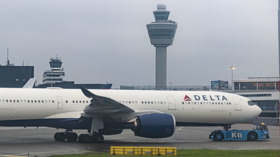 delta flight makes emergency return after slide falls off plane