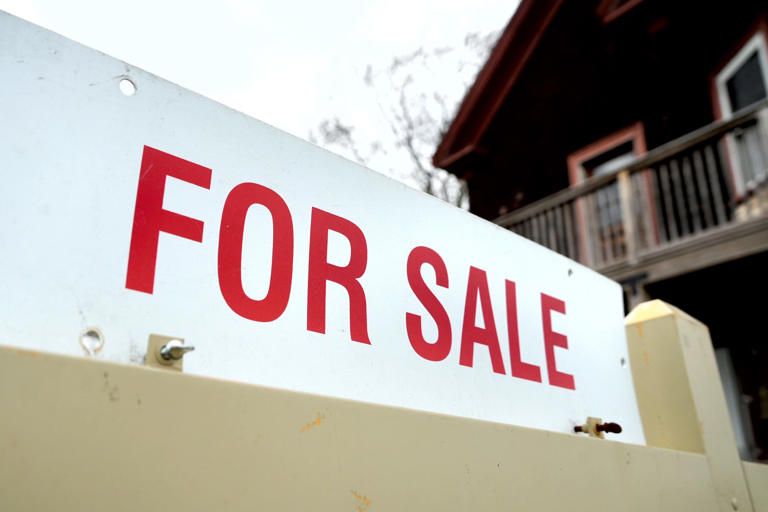 House for sale sign in East Providence.