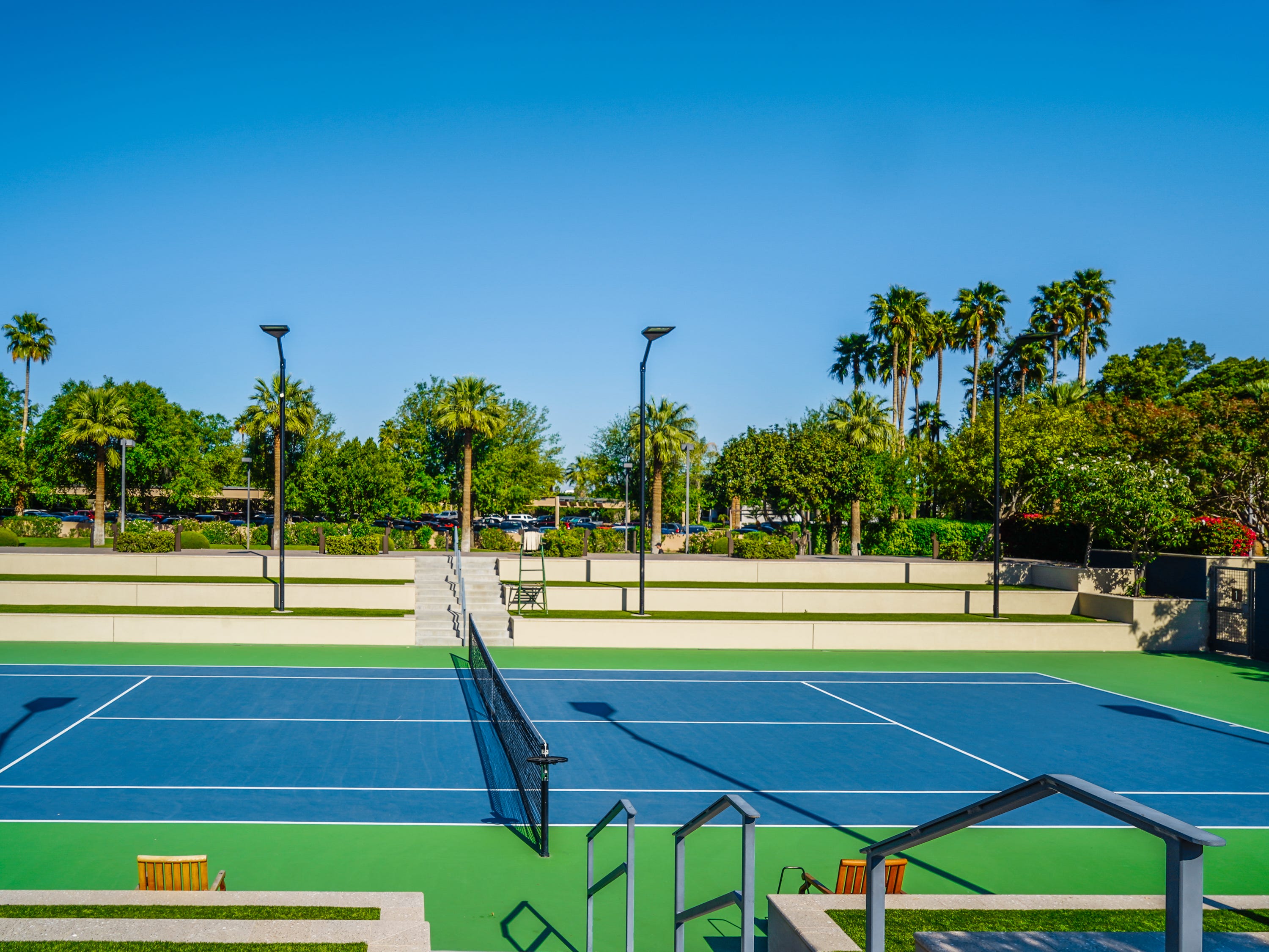 <p>The athletic club has several tennis, pickleball, and basketball courts. </p>