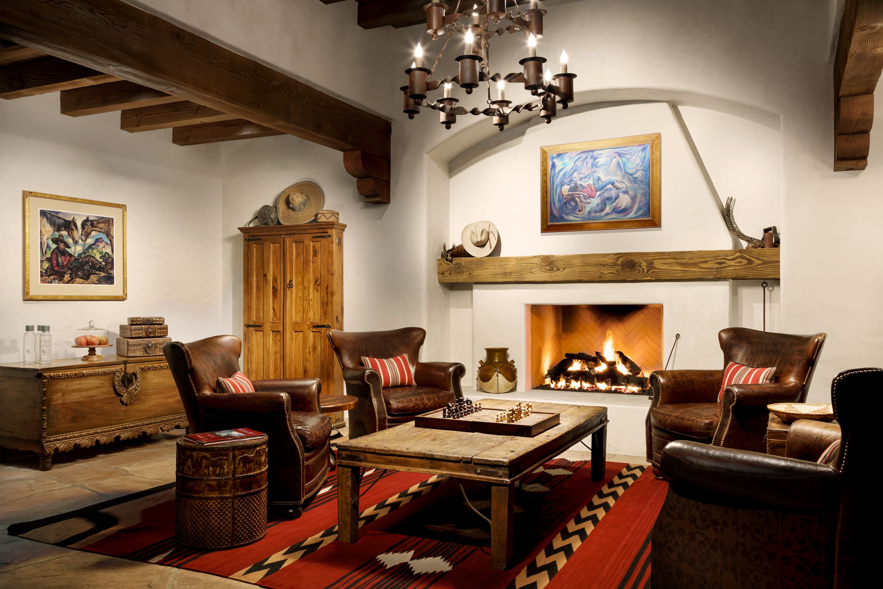 <p>Unlike the Phoenician, there's nothing modern about the Hermosa Inn's interior design.</p><p>Instead, it transports visitors to the early 20th-century West from the moment they check-in, with adobe bricks, wooden beams, and high-quality rustic furniture. The lobby and rooms showcase some of Megargee's artwork, too.</p>
