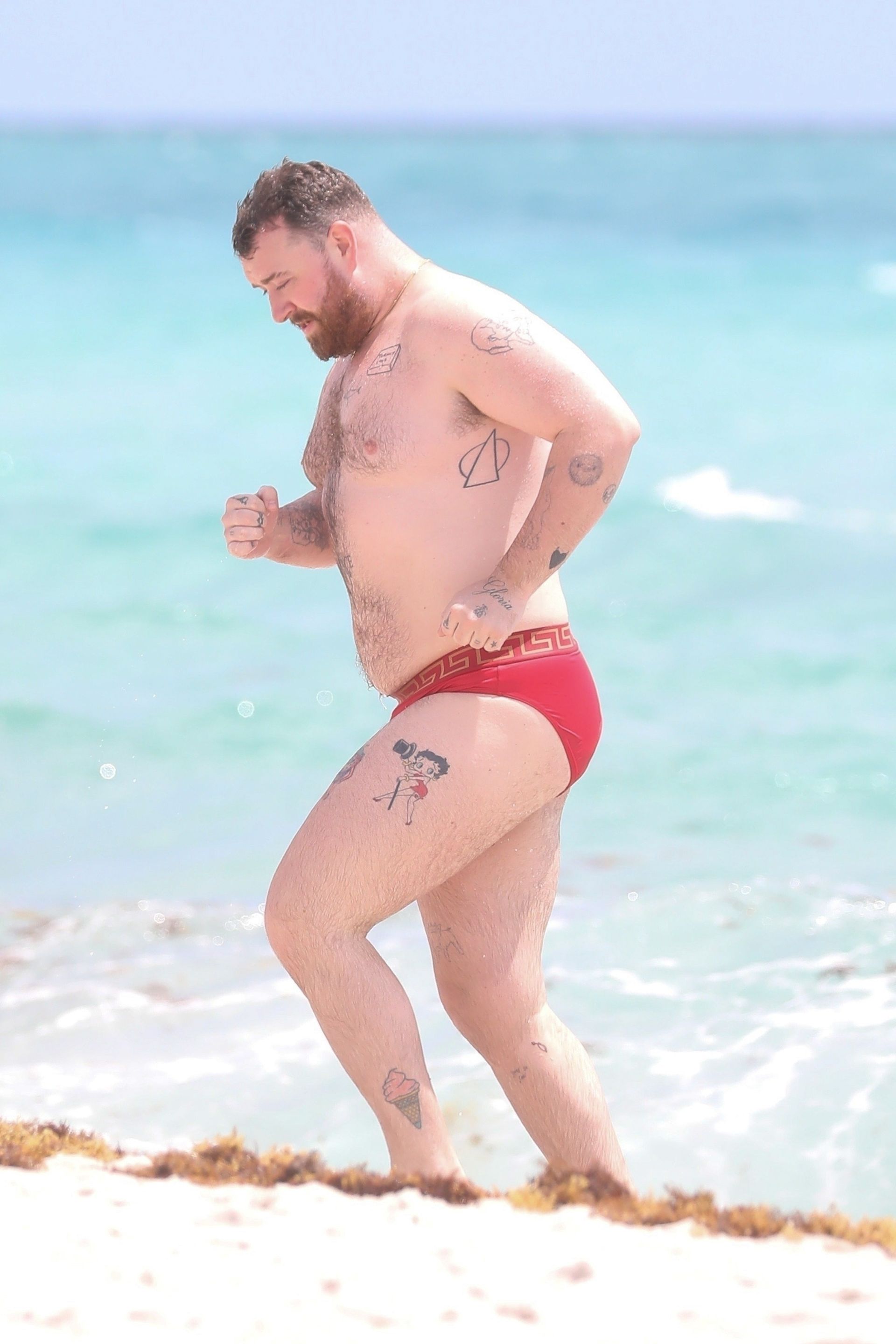 Sam Smith on the beach in Miami