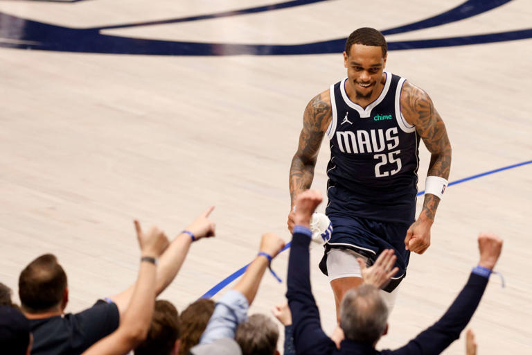 Dallas Mavericks forward P.J. Washington (25) smiles as he high fives fans after being ejected from the game during the second half of Game 3 of an NBA basketball first-round playoff series, Friday, April 26, 2024, in Dallas.