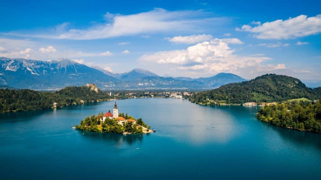 <p>Slovenia is a tiny country nestled on Italy’s northeastern border. With Austria to the north and Croatia to the south, you can probably guess how beautiful its landscapes are! Expect mountains, gorges, lakes, and even a short stretch of coastline located on the Gulf of Trieste, called the Slovene Riviera.</p><p>Then there’s Lake Bled. With its medieval church and clifftop castle, it might be Europe’s most picturesque place. Slovenia’s capital city, Ljubljana, isn’t bad either. In terms of charm, architecture, and attractions, its atmospheric old town rivals what you find in cities like Rome and Paris.</p>