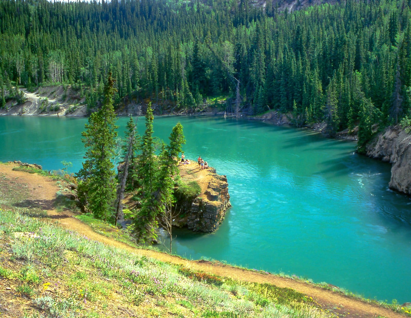 <p class="wp-caption-text">Image Credit: Shutterstock / Pecold</p>  <p><span>The Yukon River, flowing through the vast and wild landscapes of the Yukon Territory, offers an epic canoe camping journey steeped in the history of the Klondike Gold Rush. This mighty river, one of North America’s longest, serves as a lifeline through remote wilderness, providing paddlers with a true sense of adventure and isolation. The journey on the Yukon River can vary from relatively easy sections suitable for beginners to more challenging stretches that demand experience and skill. Along the way, canoeists encounter historic sites, abandoned settlements, and an abundance of wildlife, including bears, moose, and eagles, set against the backdrop of breathtaking northern scenery. The river’s clear waters and the surrounding untouched wilderness make it an ideal destination for those seeking to combine history with outdoor adventure.</span></p>