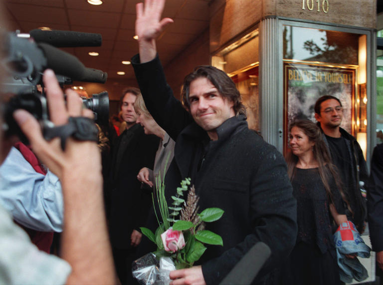 Tom Cruise waves to fans outside the McDonald Theater in Eugene in 1998 during the screening of “Without Limits.”