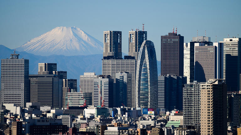 Mount Fuji and the Shinjuku skyline seen from an observation deck in Tokyo, Japan, on Tuesday, Dec. 26, 2023. Japan's industrial output in November is scheduled to be released by the Ministry of Economy, Trade and Industry on Dec. 28. Photographer: Akio Kon/Bloomberg via Getty Images Getty Images