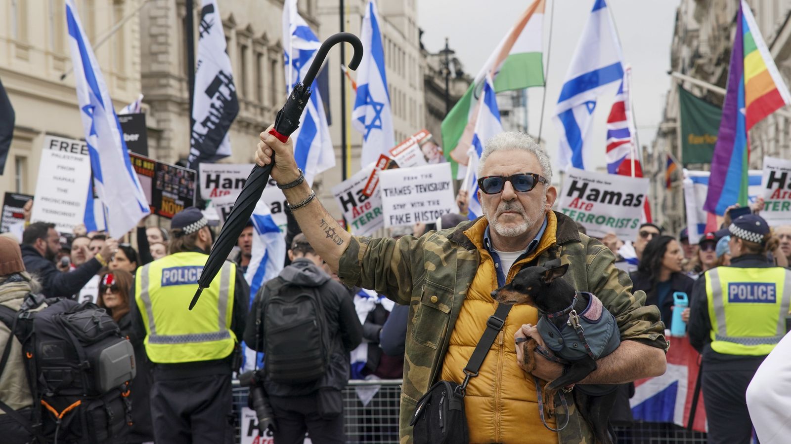 man arrested for carrying swastika placard and another held for racist remarks at pro-palestinian march