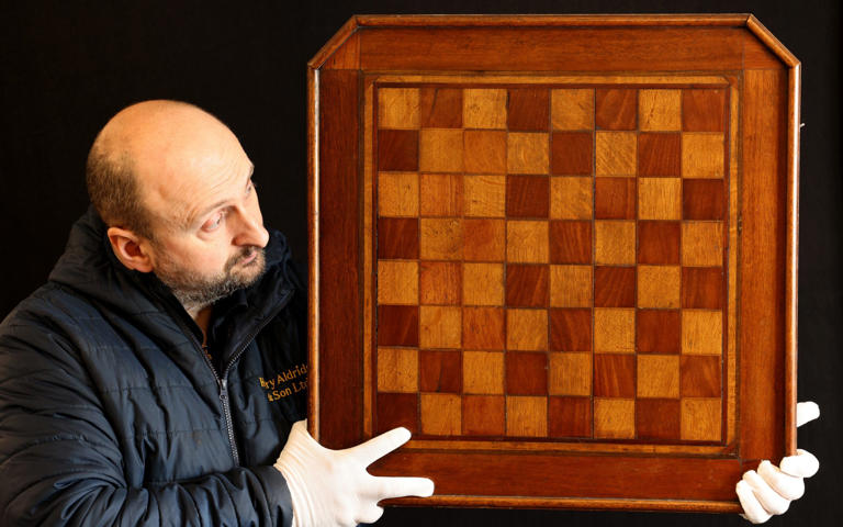 A chess board recovered from the Titanic wreck site fetched £42,000 - CORIN MESSER/BNPS