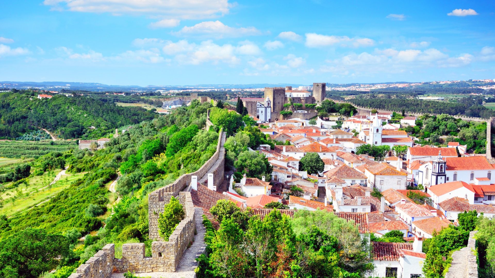 <ul> <li><strong>Average home price:</strong> $747,000</li> </ul> <p>The name of this charming historic town comes from the Latin <em>oppidum</em>, which literally means "walled city." With its medieval castle looming majestically over this quiet and almost overlooked treasure, Obidos is one of Europe's best medieval walled towns, and it's still home to about 2,000 permanent inhabitants. </p> <p>Its labyrinth of narrow, cobbled streets lined with traditional whitewashed houses is only about 50 miles north of Portugal's capital city, making it a popular day trip for tourists staying in Lisbon.</p>