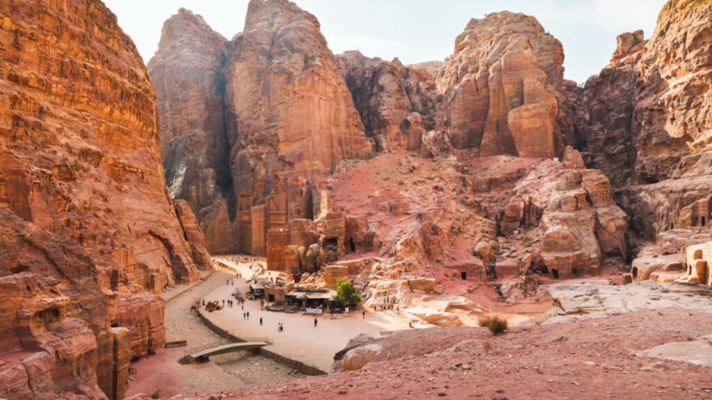 <p>This “lost city” carved out of rose-colored cliffs is unlike anything else. Approach through the winding Siq canyon, emerge to behold the Treasury’s intricate facade…it feels like an Indiana Jones film. Petra’s Nabataean builders were master engineers, and exploring the tombs, temples, and water channels reveals their skill.</p><p>Opt for the Petra at Night experience, where the Treasury is illuminated by candles, creating a magical atmosphere.</p>