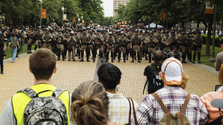 Pro-Palestinian demonstrators face off Wednesday with state officers at the University of Texas at Austin. - Jordan Vonderhaar/Bloomberg/Getty Images