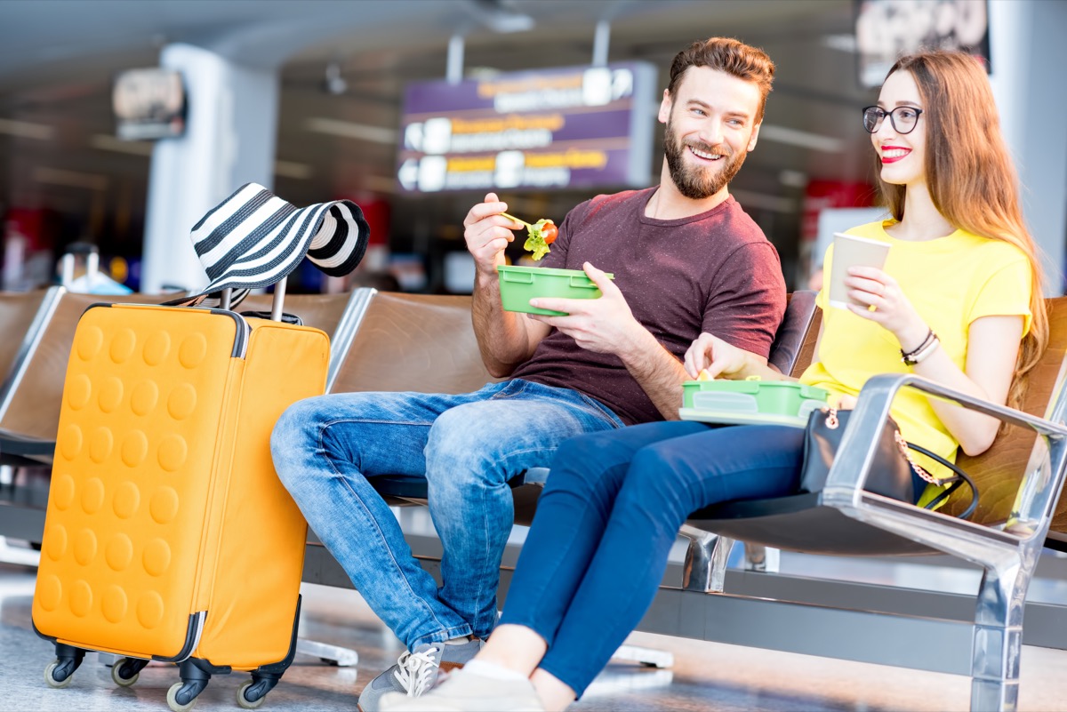 <p>It's no secret that food and drink cost a lot more in an airport than on the street. That's why having a little something on hand to tide you over is a good idea.</p><p>"You can save a lot of money by bringing your own snacks for the journey," Nelson suggests. "Instead of going to the food court for meals, pack your lunch in your backpack and enjoy that while you wait."</p><p>And it might not just come down to a matter of choice. Depending on when your next flight is, there may not be easy access to meals or a place to lie down.</p><p>"I always travel with my own stash of snacks and deck of cards in case airport lounges or restaurants are closed during my layover—which can happen if you're traveling overnight," <strong>Pamela Holt</strong>, travel expert and host of <a rel="noopener noreferrer external nofollow" href="https://www.primevideo.com/detail/Me-Myself-and-the-World/0I8FJHCFB5JZ0C1VZZQ757SZNJ"><em>Me, Myself, and the World</em></a> tells <em>Best Life</em>. "In this case, I also recommend packing a layover sleep kit that includes a silk sleep mask, ear plugs, compression socks, a small travel blanket, a toothbrush, and an extra pair of underwear."</p>