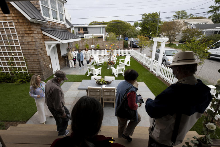 Guests walk through the McCarty home during the Historic Garden Week show in Virginia Beach, Virginia, on April 24, 2024.