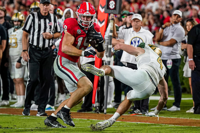 Sep 23, 2023; Athens, Georgia, USA; Georgia Bulldogs tight end Brock Bowers (19) breaks a tackle by UAB Blazers safety Ike Rowell (4) during the first half at Sanford Stadium. Mandatory Credit: Dale Zanine-USA TODAY Sports