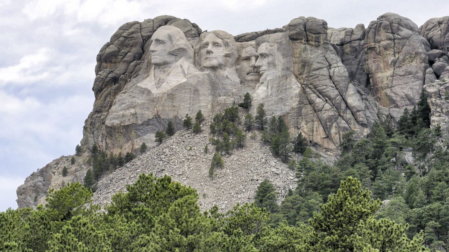 <p>Mount Rushmore is more than just a famous backdrop in movies. It’s a massive sculpture carved into a mountain, showing the faces of four U.S. presidents: George Washington, Thomas Jefferson, Abraham Lincoln, and Theodore Roosevelt. It's a real testament to American history that you should visit at least once in your lifetime.</p>