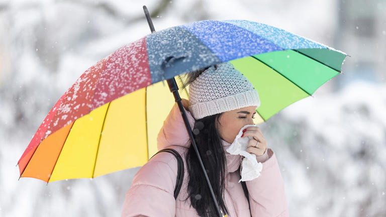 "Under the weather" applies to someone who's feeling sick. iStock