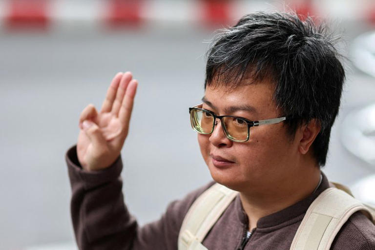 FILE PHOTO: Arnon Nampa, a prominent activist and former human rights lawyer, flashes a three finger salute as he arrives ahead of a Thai criminal court's verdict in a case of allegedly having insulted the monarchy, at the criminal court in Bangkok, Thailand, September 26, 2023. REUTERS/Athit Perawongmetha/File Photo