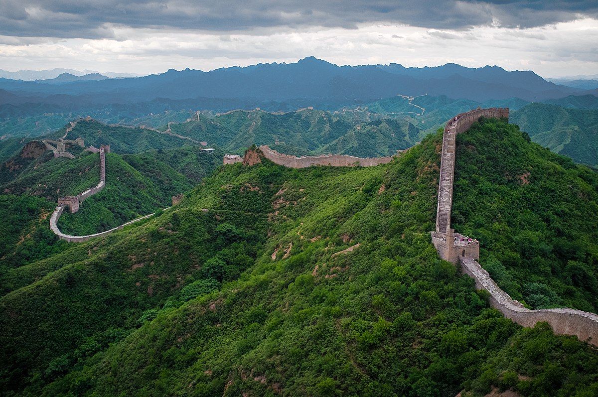 <p>The Great Wall of China, an awe-inspiring marvel of ancient engineering, stretches over 13,000 miles across northern China's rugged landscape. Originally constructed over centuries by various dynasties, the wall's primary purpose was defense, serving as a formidable barrier against invading nomadic tribes. Built using a variety of materials, including stone, brick, tamped earth, and wood, it features watchtowers, fortified passes, and beacon towers strategically positioned along its length. While it didn't prevent all invasions, the Great Wall stands as a symbol of China's enduring strength, unity, and determination. Today, it remains one of the most iconic and visited historical sites in the world, captivating travelers with its breathtaking vistas and rich cultural significance.</p>