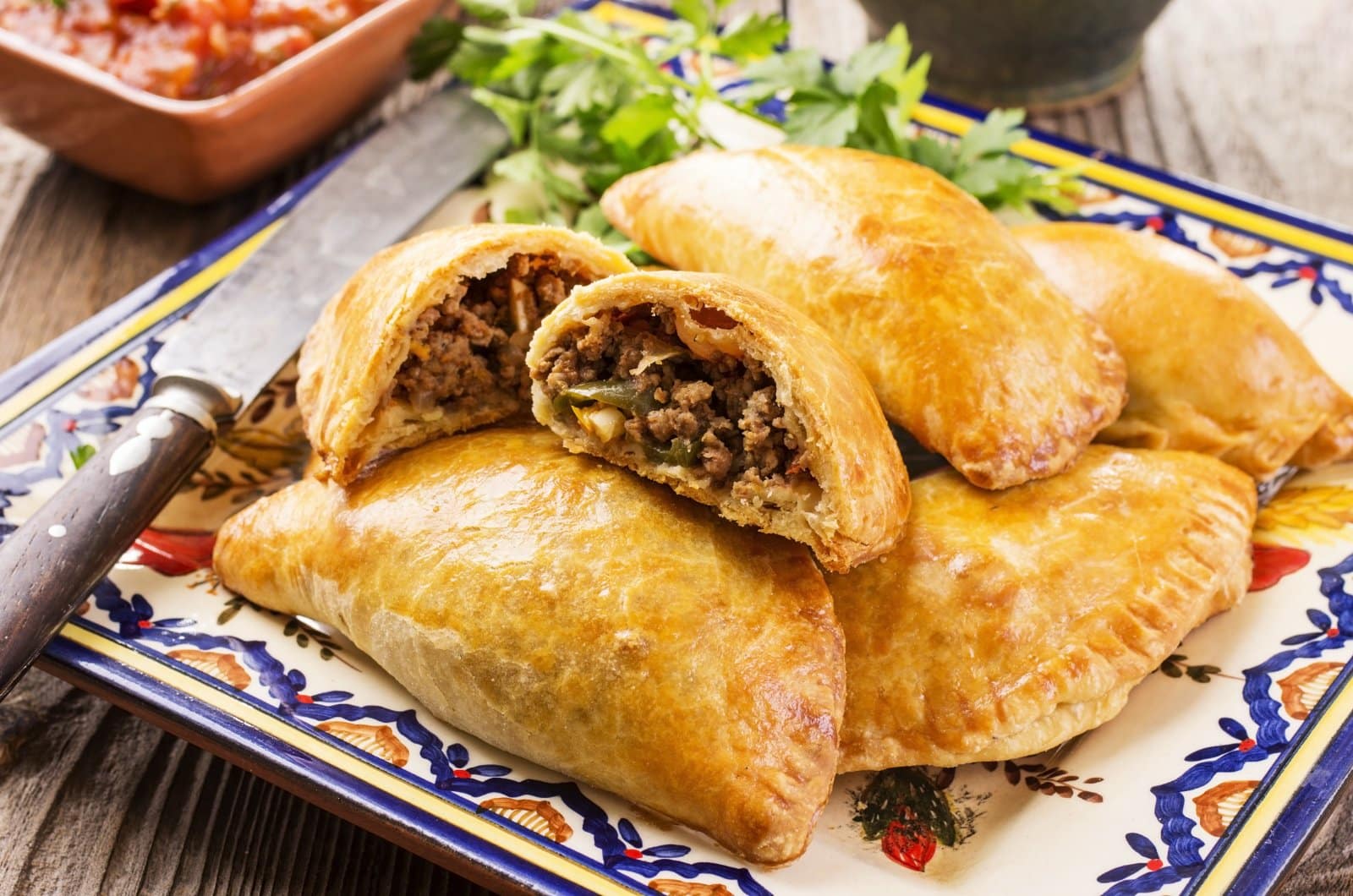 Image Credit: Shutterstock / hlphoto <p><span>These stuffed pastries can be filled with anything from meat to cheese to fruit, making them a versatile snack across Latin America.</span></p>