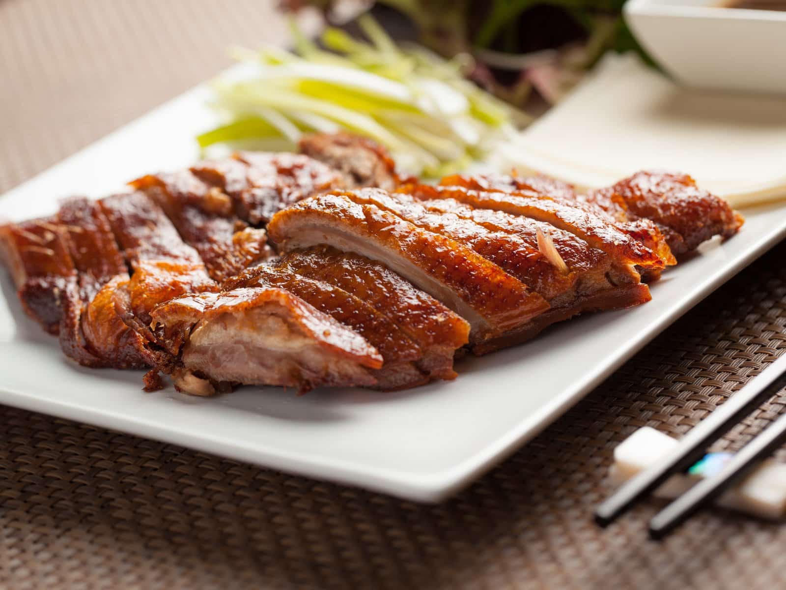 Image Credit: Shutterstock / BBstockimage <p><span>Crispy skin, succulent meat, and a rich history make Peking Duck a must-try. Served with pancakes, scallions, and hoisin sauce, it’s a dish fit for emperors.</span></p>