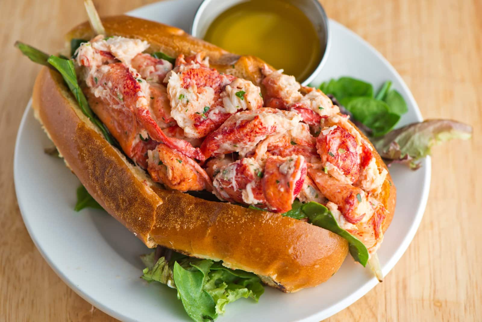 Image Credit: Shutterstock / RFondren Photography <p><span>Fresh, succulent lobster meat dressed in mayo and packed into a buttered, toasted roll – New England’s gift to seafood lovers.</span></p>
