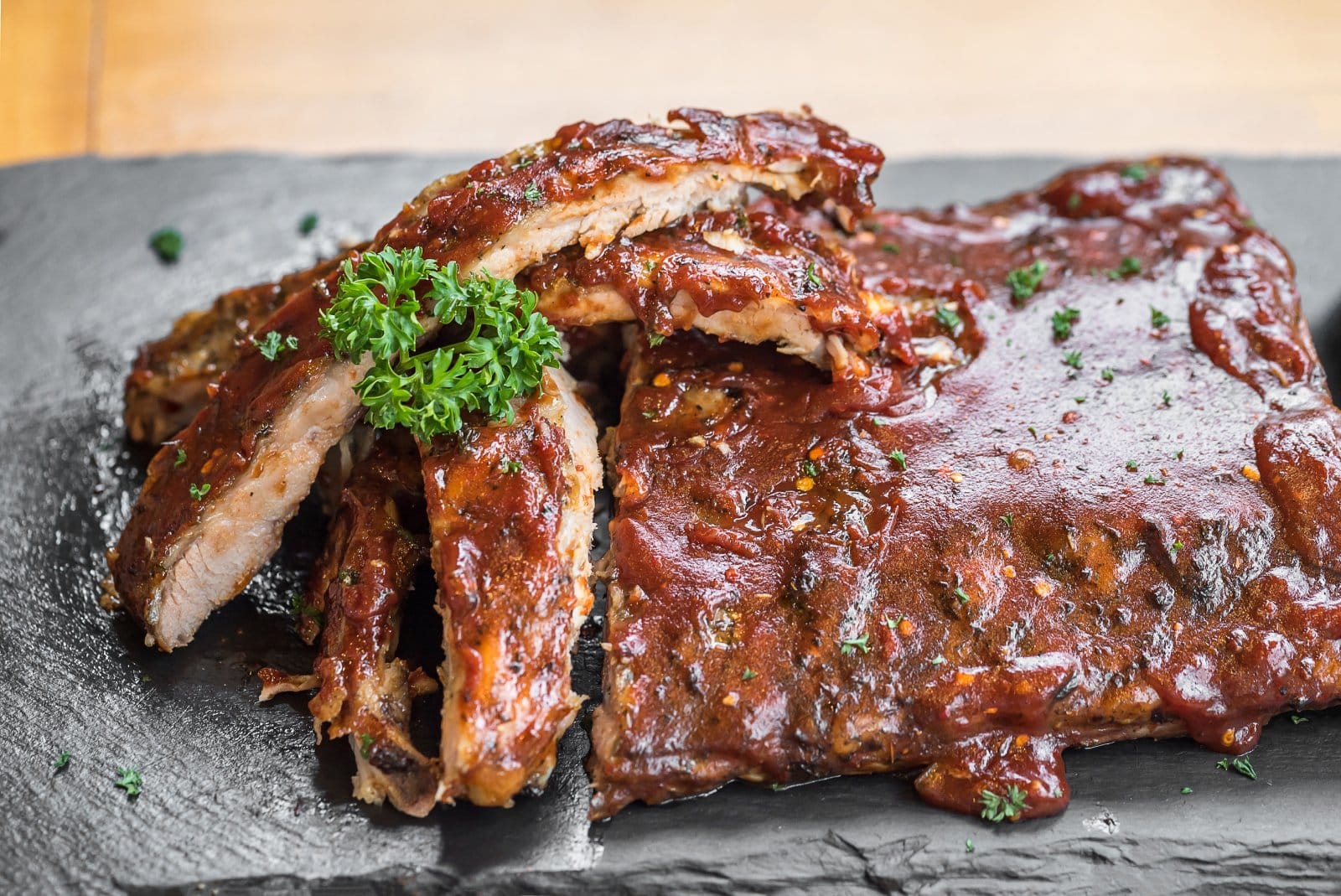 Image Credit: Shutterstock / vichie81 <p><span>Slow-cooked to perfection, American barbecue ribs, slathered in a tangy, smoky sauce, are a finger-licking journey to the heart of American cuisine.</span></p>