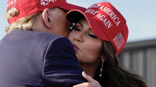 Republican presidential candidate and former President Donald Trump, left, embraces South Dakota Gov. Kristi Noem at a campaign rally, Saturday, March 16, 2024, in Vandalia, Ohio. AP Newsroom