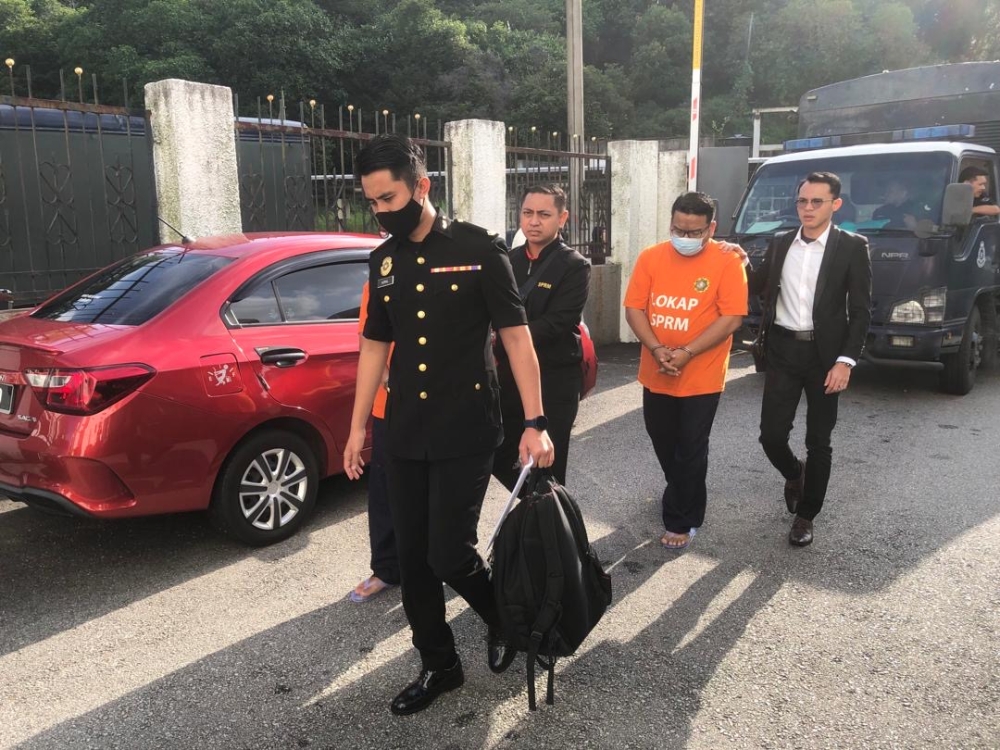 two johor water company execs remanded another day for alleged kickback, forgery investigation