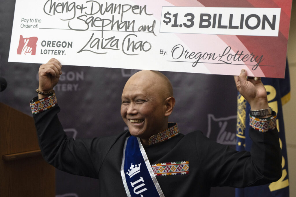 $1.3b powerball jackpot winner is immigrant from laos, who has cancer