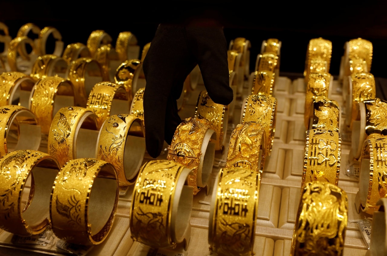 gold prices set for third straight monthly gain: should you invest for long-term?