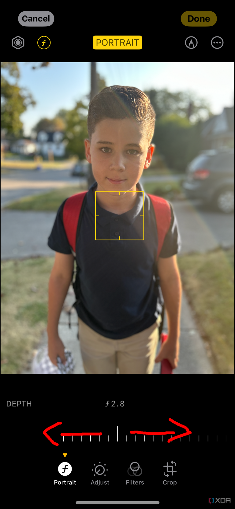 iPhone Photo library with a portrait photo of a young boy and depth selected with arrows pointing left and right on the slider.