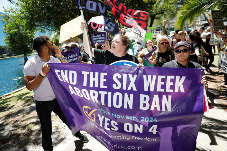 FILE PHOTO: Abortion rights advocates gather to launch their 'Yes On 4' campaign with a march and rally against the six-week abortion ban ahead of November 5, when Florida voters will decide on whether there should be a right to abortion in the state, in Orlando, Florida, U.S. April 13, 2024. REUTERS/Octavio Jones/File Photo