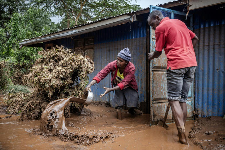 A makeshift dam burst its banks in Kenya's Rift Valley, sending torrents of water and mud gushing down a hill