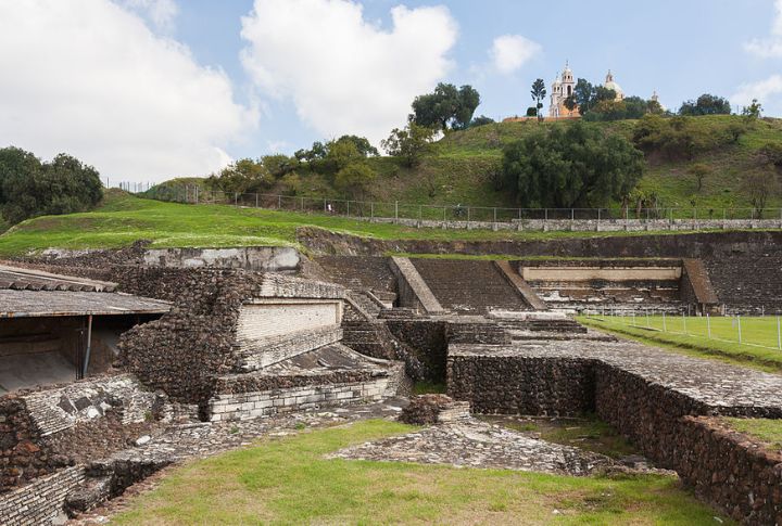 <p>This whopper in Cholula, Mexico, is the world’s largest pyramid by volume, exceeding the Great Pyramid of Giza! Archaeological evidence suggests construction began around the 2nd century BC and continued for centuries. Built by the Toltecs, it was dedicated to Quetzalcoatl, a deity in Aztec culture. Unlike the smooth-sided pyramids of Egypt, the Great Pyramid of Cholula has a layered appearance due to continuous construction and remodeling over centuries.</p>