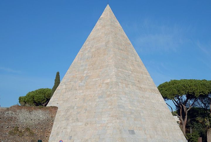 <p>Even the Romans got in on the pyramid craze! The Pyramid of Caius Cestius Gallus, or the Pyramid of Rome. Built around 18-12 BC, the Pyramid of Cestius is one of the best-preserved examples of ancient Egyptian-style architecture in Rome. The pyramid was commissioned as a tomb for Gaius Cestius Epulone, a wealthy Roman magistrate and member of a prestigious religious society. While the pyramid’s form evokes Egypt, its construction materials are distinctly Roman. The core is built of concrete faced with bricks, and the exterior is clad in slabs of white marble. </p>