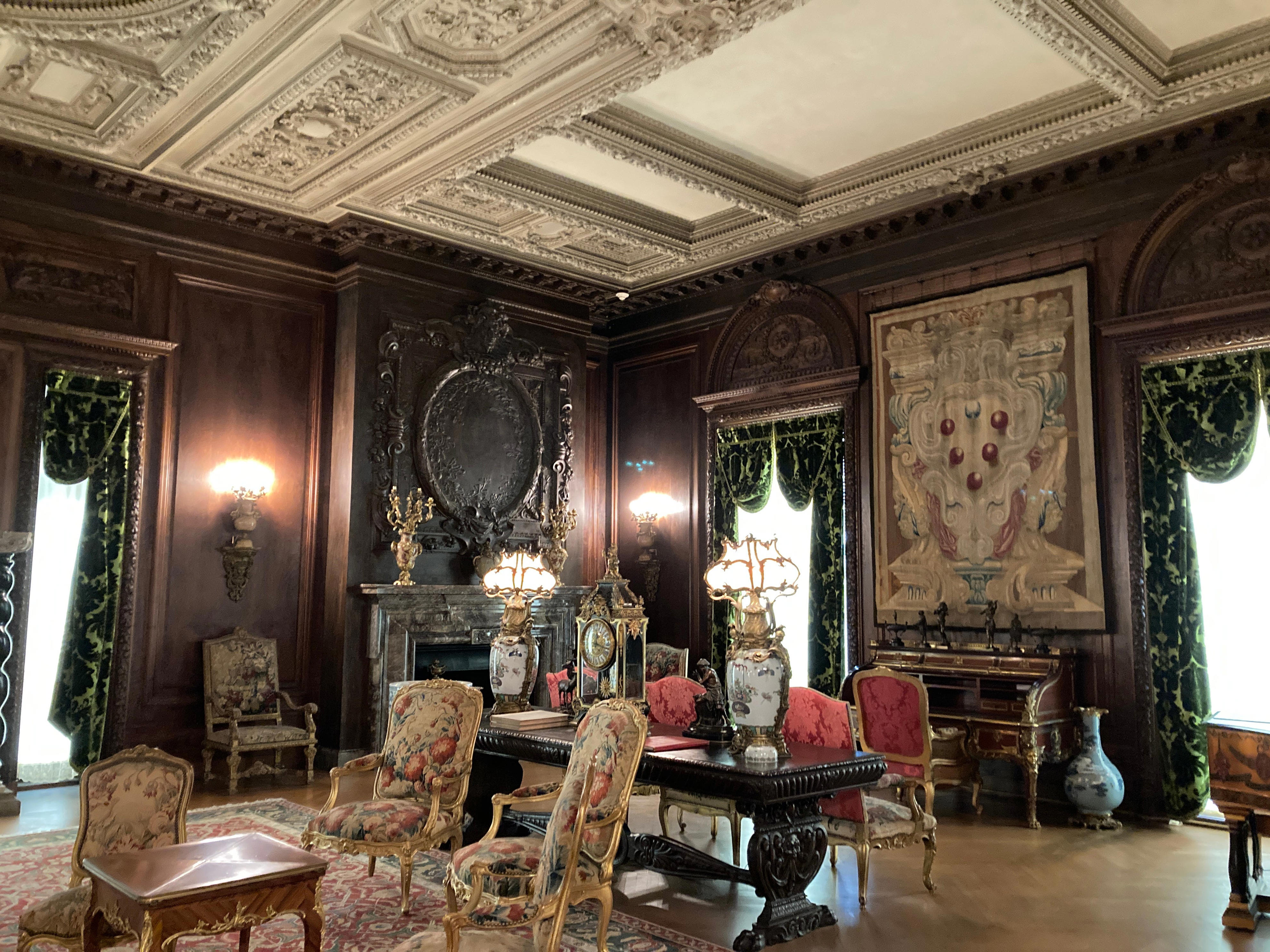 <p>Decorated with antique Renaissance furniture, the living room featured Circassian walnut panels on the walls.</p>