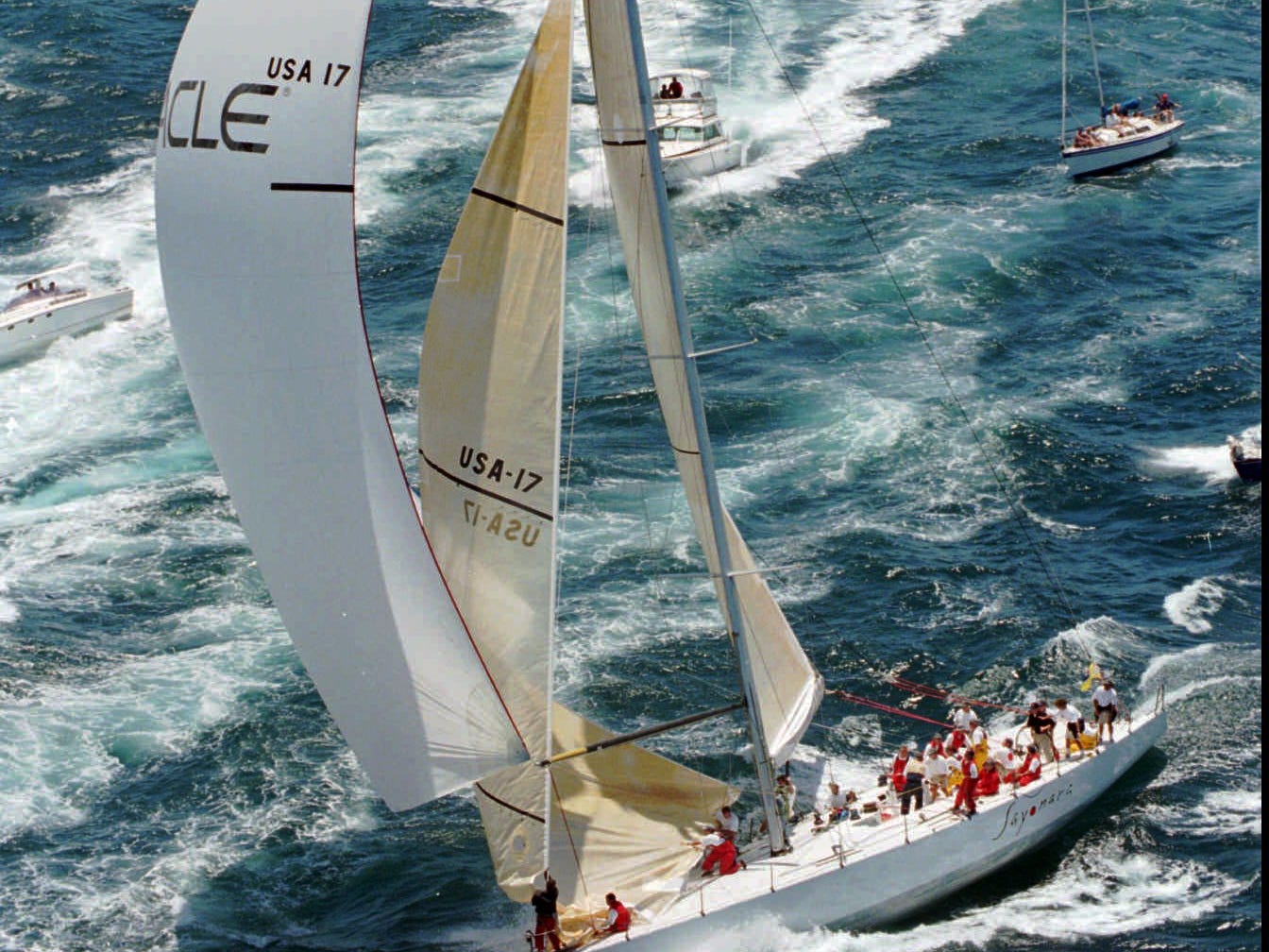 <p>With Ellison as Oracle's major shareholder, his millions kept rolling in. He started to indulge in some expensive hobbies — including yacht racing. That's Ellison at the helm during a 1995 race.</p><p>He also partly financed the BMW Oracle USA sailing team, which won the America's Cup in 2010, according to <a href="https://www.bloomberg.com/billionaires/profiles/lawrence-j-ellison/" rel="noopener">Bloomberg.</a></p>