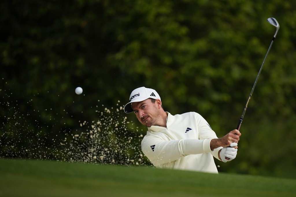 <p>Nick Taylor, of Canada, hits from the bunker on the 10th hole during a practice round in preparation for the Masters golf tournament at Augusta National Golf Club Wednesday, April 10, 2024, in Augusta, GA. </p>