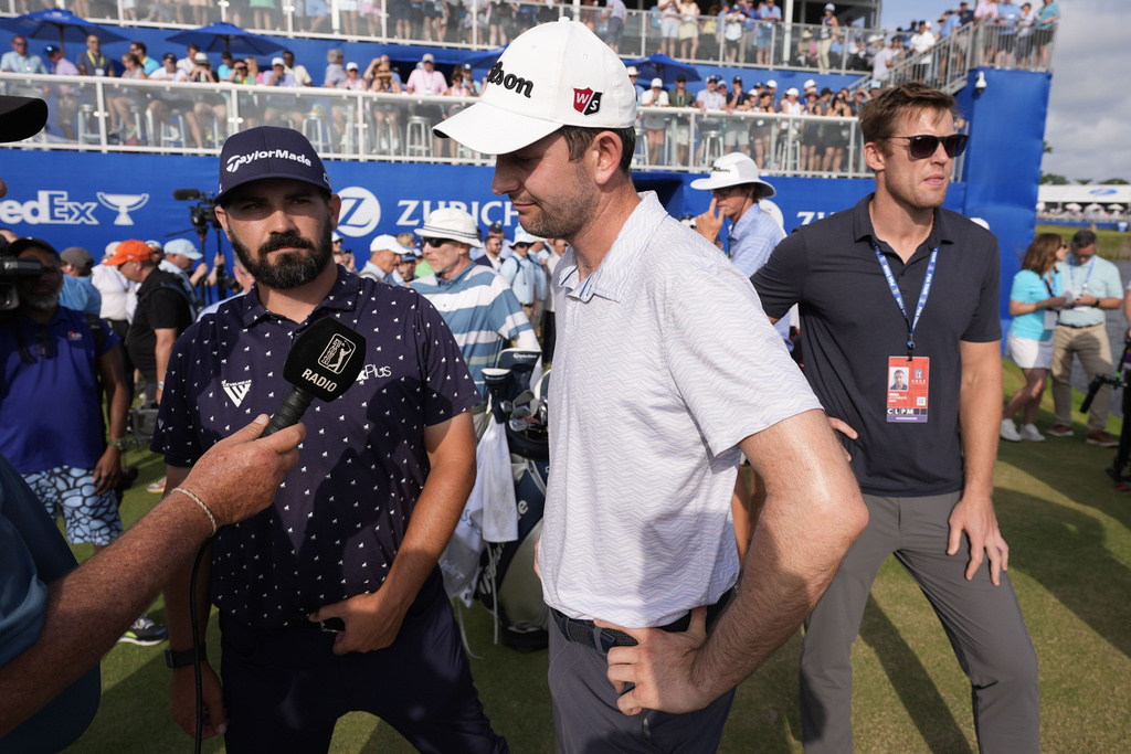 <p>Chad Ramey, left, and teammate Martin Trainer, are interviewed on the 18th green after losing in a playoff to Rory McIlroy, of Northern Ireland, and Shane Lowry, of Ireland, for the PGA Zurich Classic golf tournament at TPC Louisiana in Avondale, La., Sunday, April 28, 2024. </p>