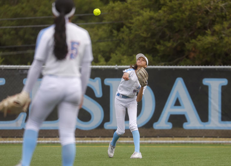 Hillsdale's Sophia Shelton (32) throws to the infield off of a single hit by Burlingame's Kiley Lyon (8) in the seventh inning at Hillsdale High School in San Mateo, Calif., on Thursday, April 25, 2024.