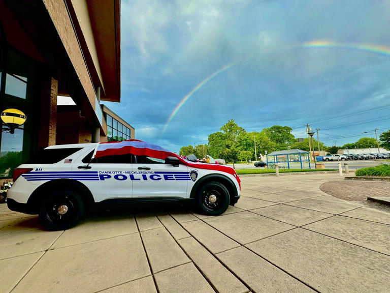 Rainbow over fallen CMPD officer's cruiser