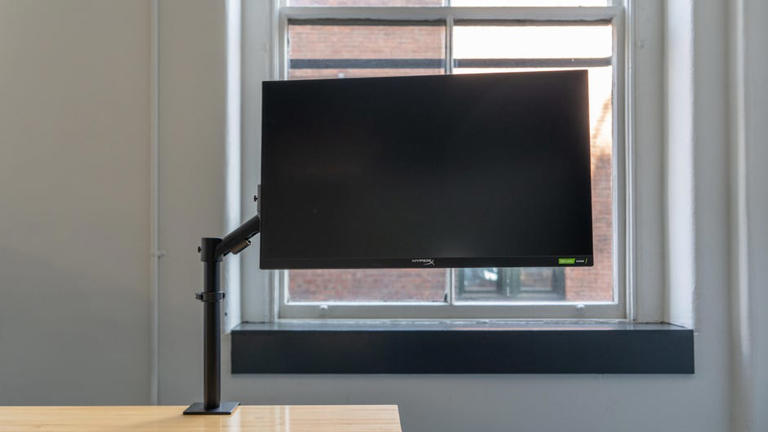Using monitor arms will let you adjust your dual-monitor setup with ease. Sarah Tew/CNET