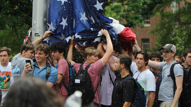 UNC Chapel Hill students hold up the American flag during a campus protest on Tuesday, April 30, 2024. Anti-Israel agitators replaced the American flag with the Palestinian one during the demonstration. Fox News