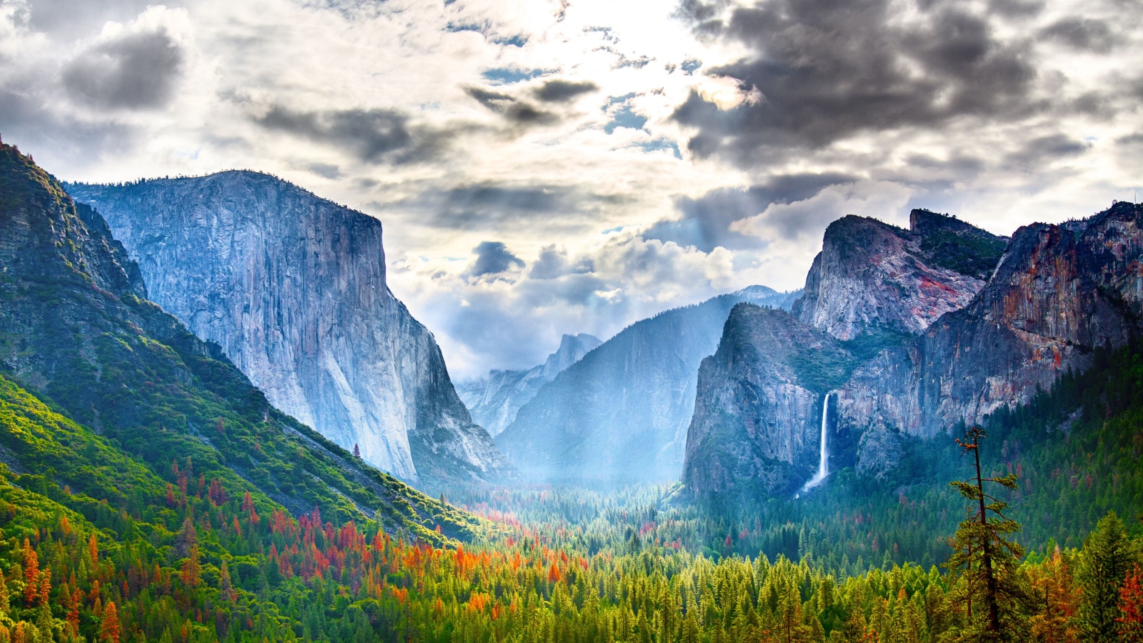 <p>Situated in the Sierra Nevada Mountains, Yosemite is renowned for its towering waterfalls, ancient giant sequoia trees, granite cliffs like El Capitan and Half Dome, and diverse ecosystems, making it a mecca for outdoor enthusiasts and photographers.</p>