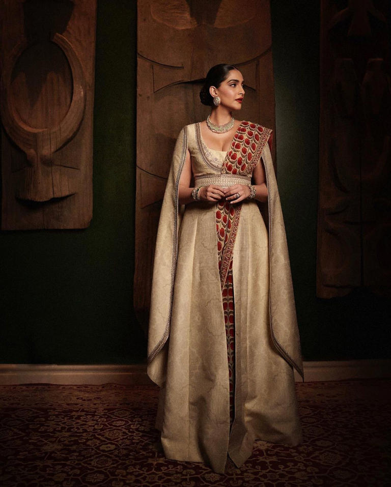 Sonam Kapoor Ahuja in an ivory saree with a cape blouse