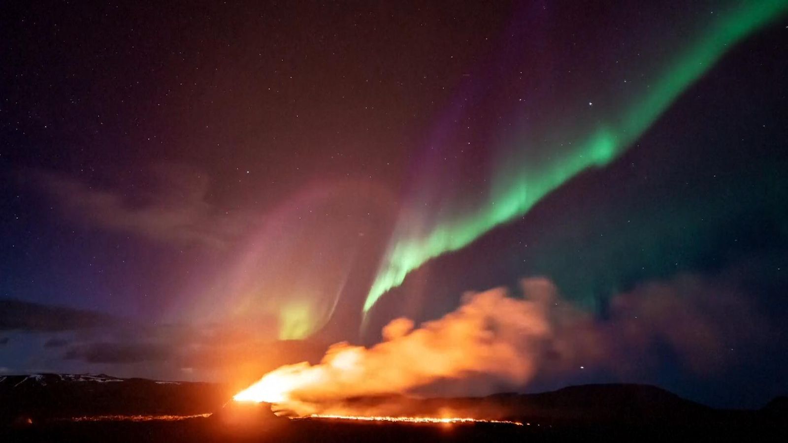 Iceland's Volcano Erupts With Northern Lights