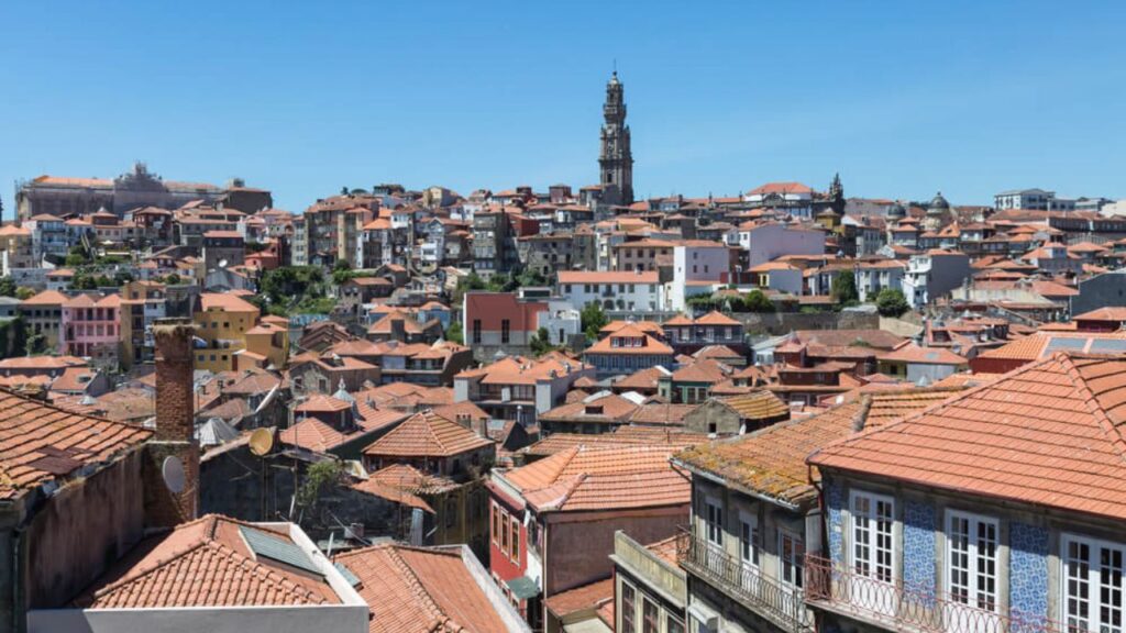 <p>One of Europe’s tourist hotspots, Porto is known for its magnificent colored houses and Cais da Ribeira, surrounded by cafes, restaurants, and shops on every corner. If you’re a book lover, come to Livraria Lello and wander into the endless bookshop.</p><p>Besides those places, you can also explore Palácio da Bolsa and see its eclectic interiors and neoclassical design. You can also visit Foz do Douro, a place close to Porto where the river meets the ocean. Here, you can find a long promenade with pines, palms, and a beautiful pergola, where you can watch the water splash on the shore.</p>